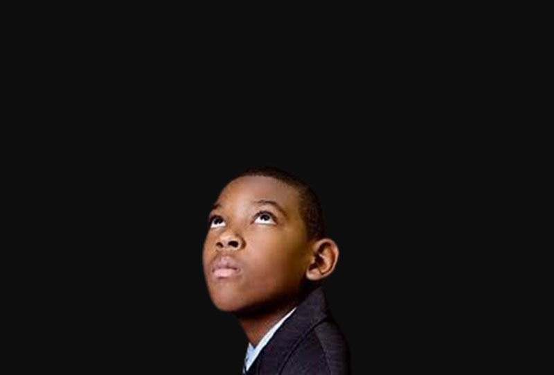 a young black man gazing into space | A Simple Rich History of Content and Content Creation 